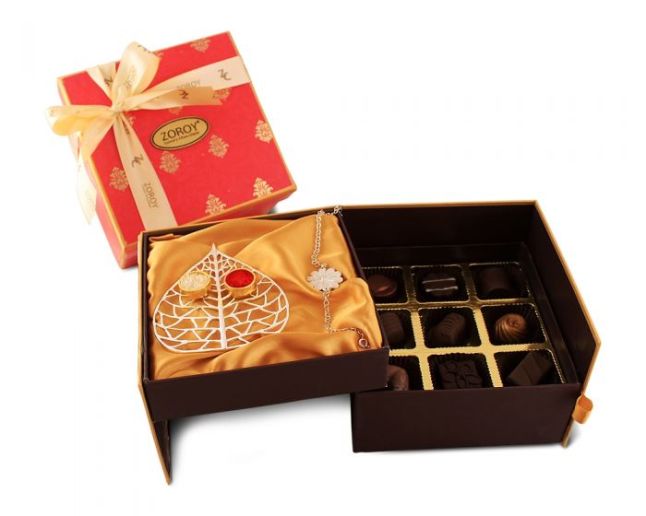 Layered Rakhi Box with 9 assorted chocolates, Silver coated plate with gold coated bowls for Kumkum and akshaj and Silver coated bracelet Rakhi